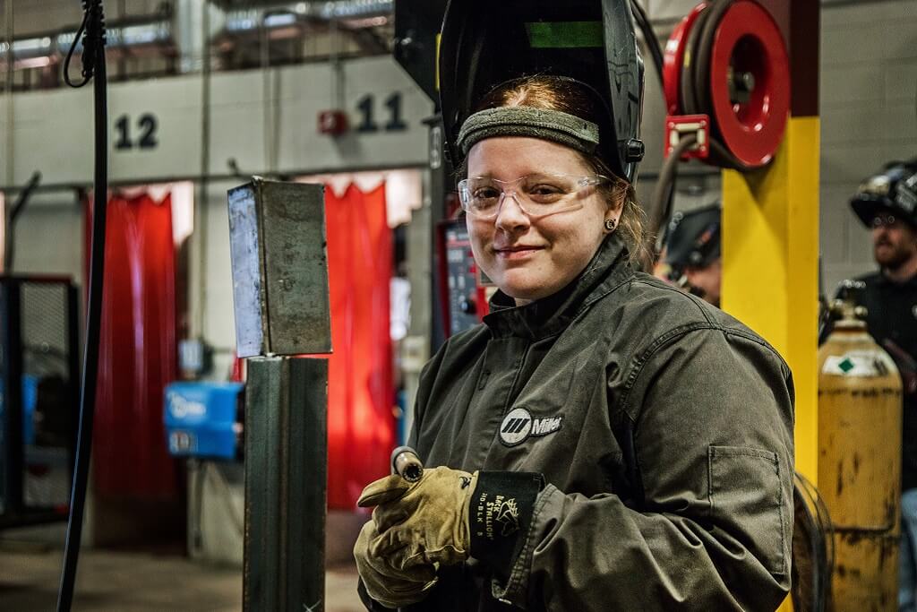 female welder in class