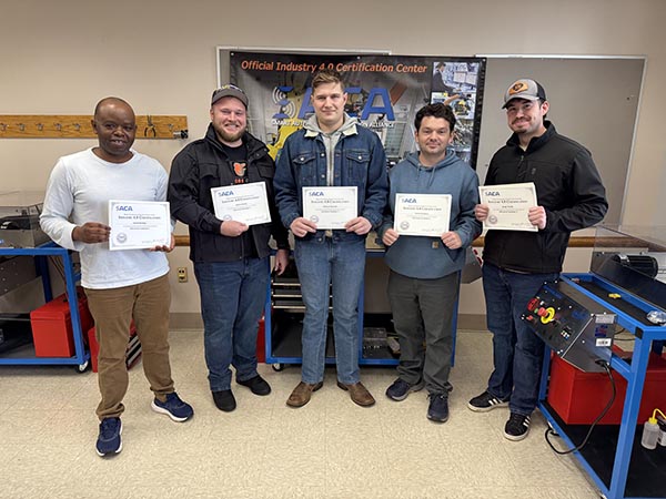 5 students holding their certifates. 